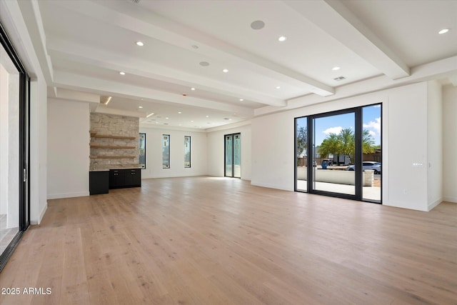 6202 E Larkspur Dr, Scottsdale, AZ 85254 - unfurnished living room with light wood finished floors, beam ceiling, plenty of natural light, baseboards, and recessed lighting