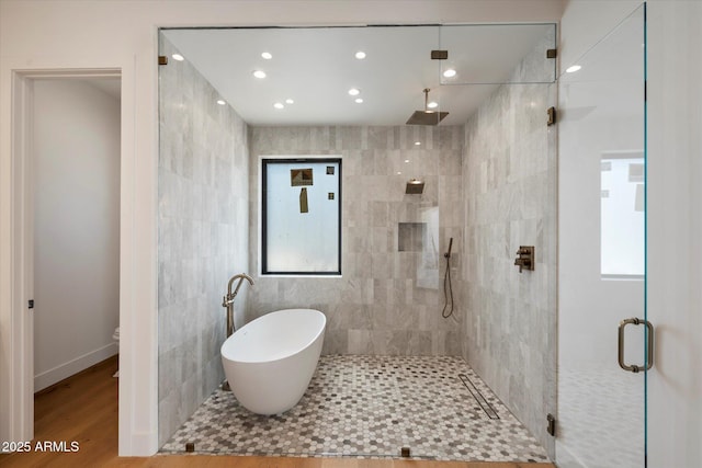 6202 E Larkspur Dr, Scottsdale, AZ 85254 - bathroom featuring a shower stall, a freestanding bath, recessed lighting, toilet, and wood finished floors