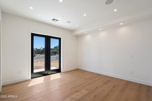 6202 E Larkspur Dr, Scottsdale, AZ 85254 - spare room with french doors, recessed lighting, baseboards, and light wood finished floors