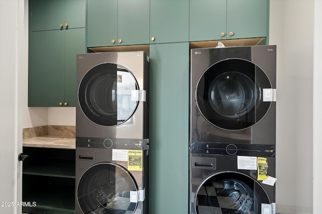 6202 E Larkspur Dr, Scottsdale, AZ 85254 - washroom featuring stacked washing machine and dryer and cabinet space