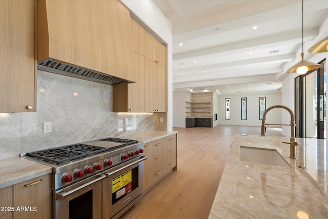 6202 E Larkspur Dr, Scottsdale, AZ 85254 - kitchen with range with two ovens, a sink, modern cabinets, light brown cabinets, and recessed lighting