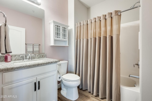 full bath with shower / tub combo with curtain, vanity, toilet, and wood finished floors