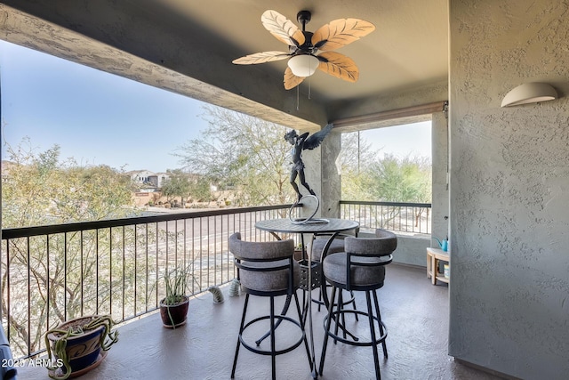 balcony featuring ceiling fan