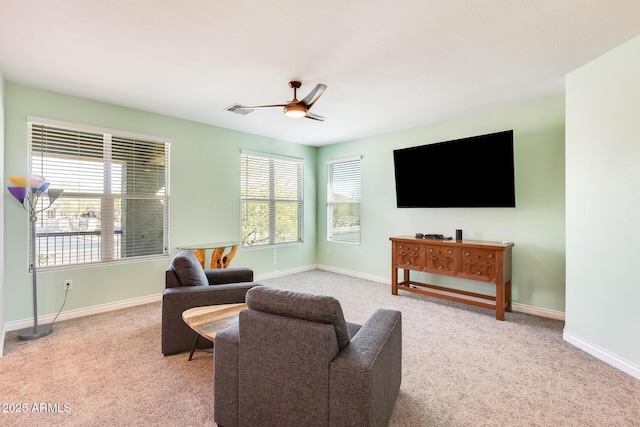 living room with carpet floors, baseboards, and visible vents