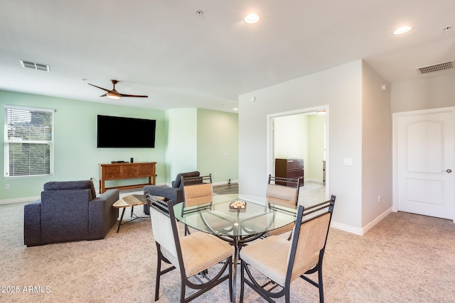 dining space featuring recessed lighting, visible vents, and light carpet