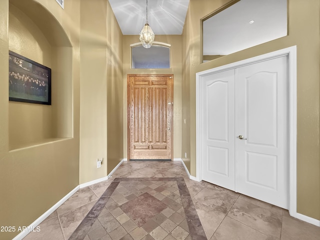 foyer with an inviting chandelier