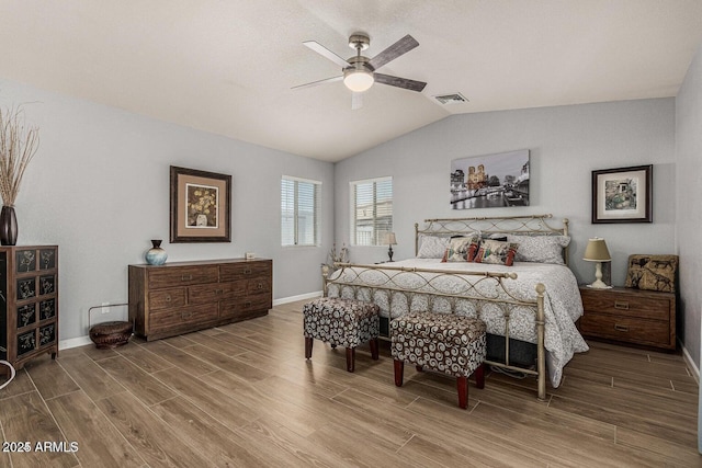 bedroom with ceiling fan and vaulted ceiling