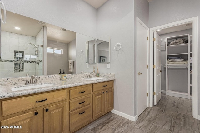 bathroom featuring vanity and walk in shower