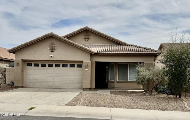 12371 W Hadley St, Avondale, AZ 85323 - view of front of home with a tile roof, an attached garage, stucco siding, and concrete driveway