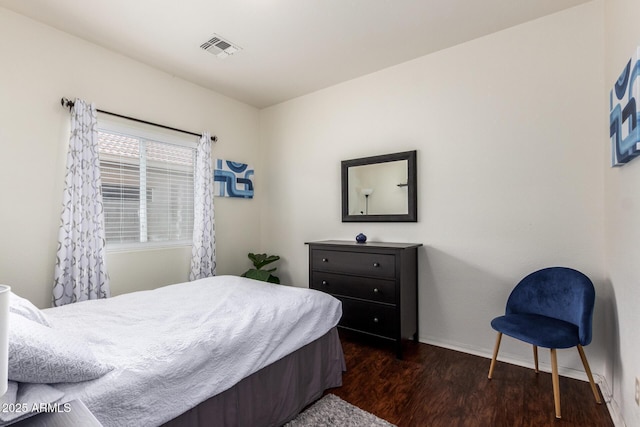 12371 W Hadley St, Avondale, AZ 85323 - bedroom with visible vents, baseboards, and dark wood finished floors