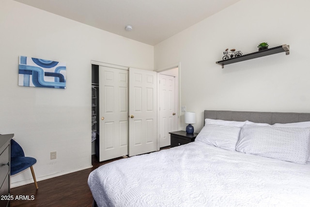 12371 W Hadley St, Avondale, AZ 85323 - bedroom featuring a closet, baseboards, and wood finished floors