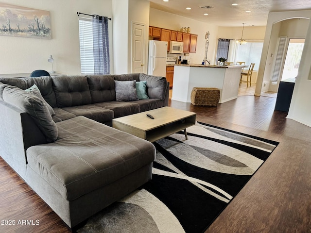 12371 W Hadley St, Avondale, AZ 85323 - living room with a chandelier, recessed lighting, visible vents, and wood finished floors