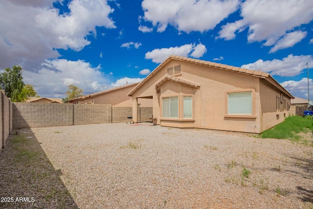 12371 W Hadley St, Avondale, AZ 85323 - rear view of property featuring a fenced backyard and stucco siding
