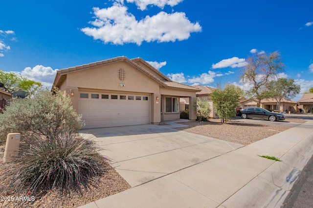 12371 W Hadley St, Avondale, AZ 85323 - single story home featuring driveway, stucco siding, a tile roof, and a garage