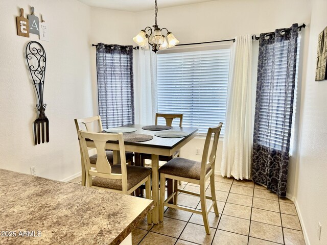 12371 W Hadley St, Avondale, AZ 85323 - dining space with an inviting chandelier, baseboards, and light tile patterned floors