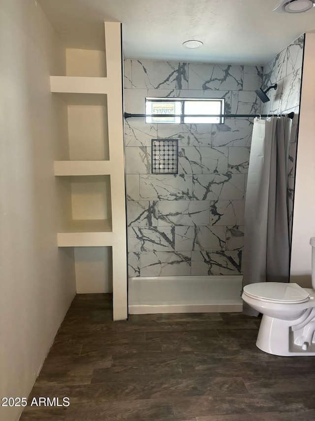 bathroom with toilet and curtained shower