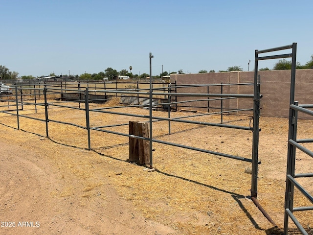 view of yard with a rural view and an outdoor structure