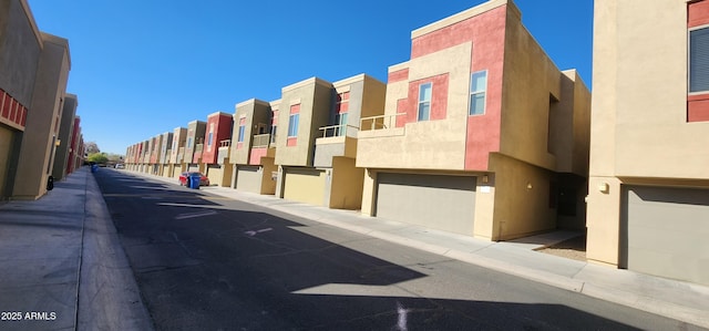 view of road featuring sidewalks, a residential view, and curbs