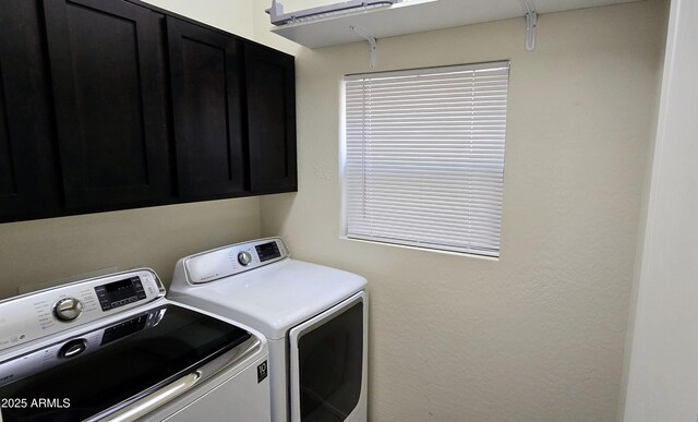 laundry area featuring cabinet space and washing machine and dryer