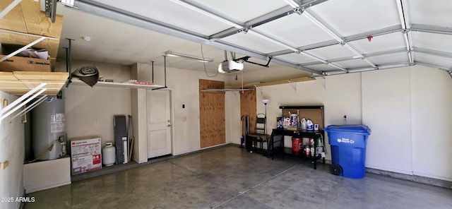 garage with a garage door opener and water heater