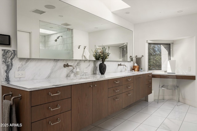 interior space with vanity, tile patterned flooring, decorative backsplash, and a shower