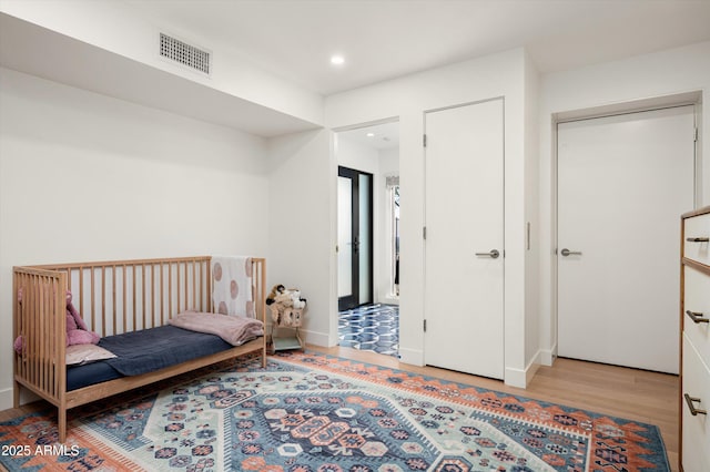 bedroom featuring light wood-type flooring