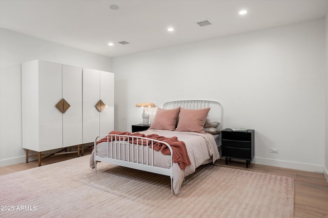 bedroom featuring light hardwood / wood-style flooring