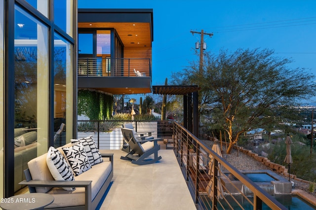 view of patio featuring a balcony