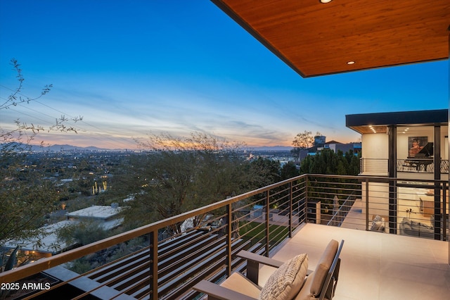 view of balcony at dusk