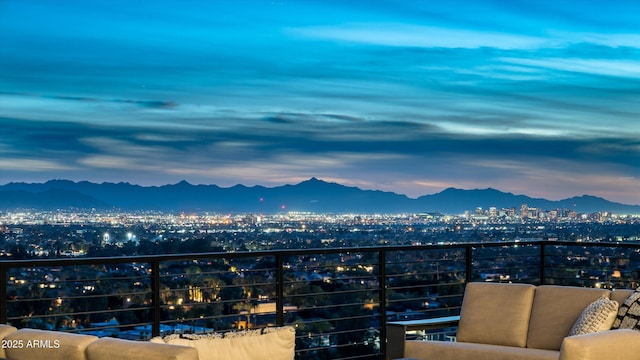 balcony at dusk with a mountain view