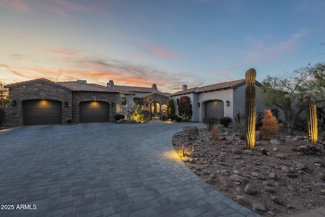 mediterranean / spanish-style home featuring a garage