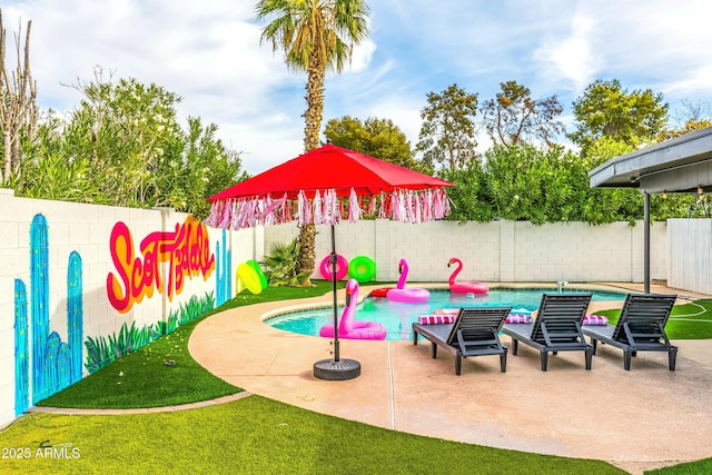 view of play area featuring a patio and a fenced in pool