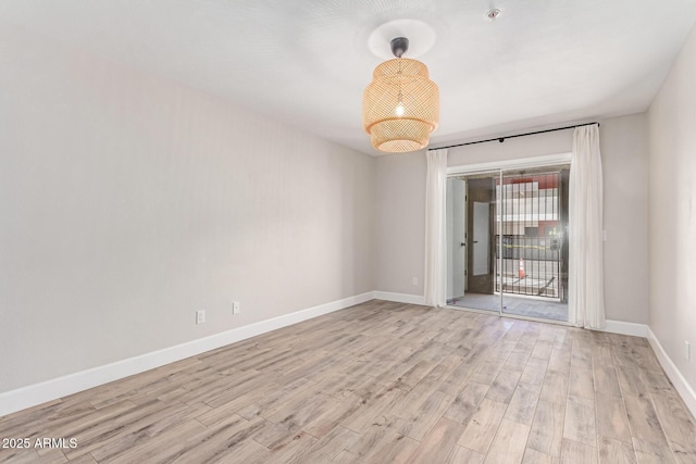 1650 N 87th Ter Unit 25A, Scottsdale, AZ 85257 - unfurnished room with light wood-style floors and baseboards