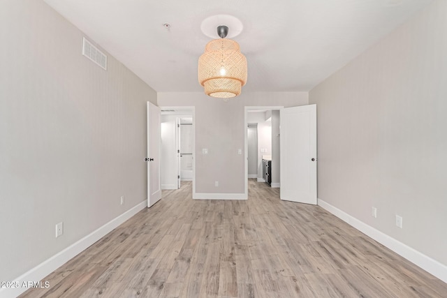 1650 N 87th Ter Unit 25A, Scottsdale, AZ 85257 - unfurnished bedroom with light wood-style flooring