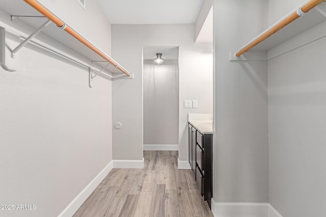 1650 N 87th Ter Unit 25A, Scottsdale, AZ 85257 - spacious closet with light wood-style flooring