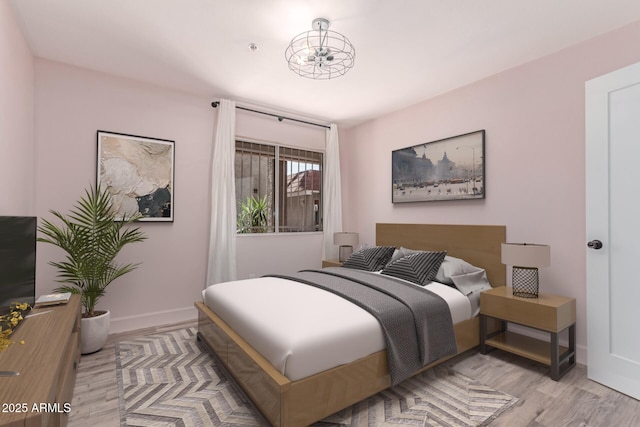 1650 N 87th Ter Unit 25A, Scottsdale, AZ 85257 - bedroom with wood finished floors and baseboards