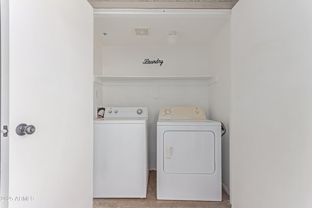 1650 N 87th Ter Unit 25A, Scottsdale, AZ 85257 - laundry room with washing machine and clothes dryer and wood finished floors