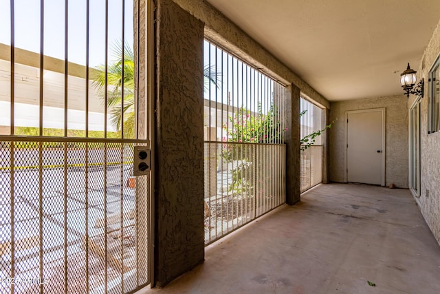 1650 N 87th Ter Unit 25A, Scottsdale, AZ 85257 - doorway to outside featuring concrete floors