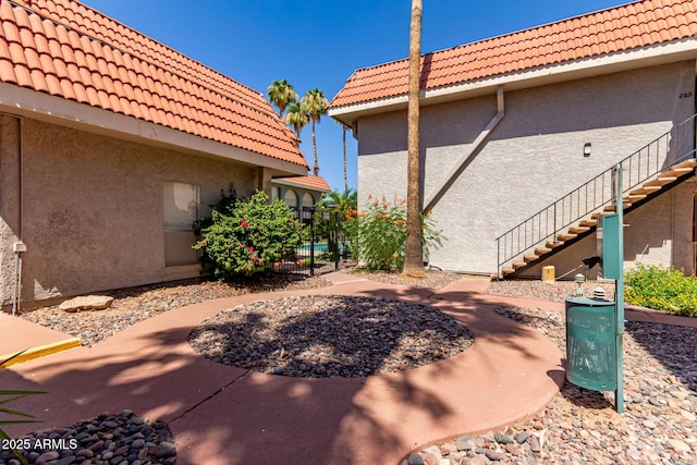1650 N 87th Ter Unit 25A, Scottsdale, AZ 85257 - view of patio featuring stairway