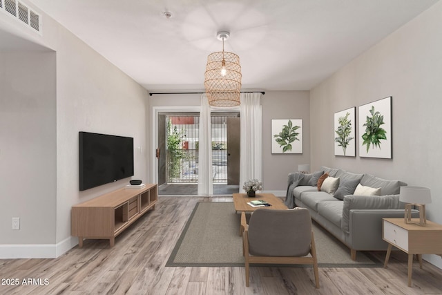 1650 N 87th Ter Unit 25A, Scottsdale, AZ 85257 - living area featuring light wood-style floors