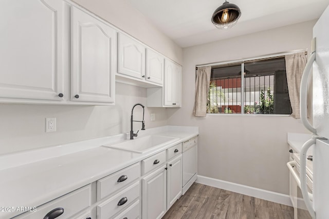 1650 N 87th Ter Unit 25A, Scottsdale, AZ 85257 - kitchen with white appliances, white cabinets, light wood-style floors, and light countertops