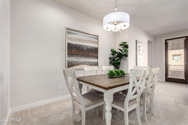 view of carpeted dining area