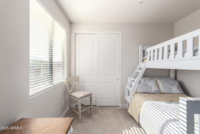 bedroom with a closet and carpet