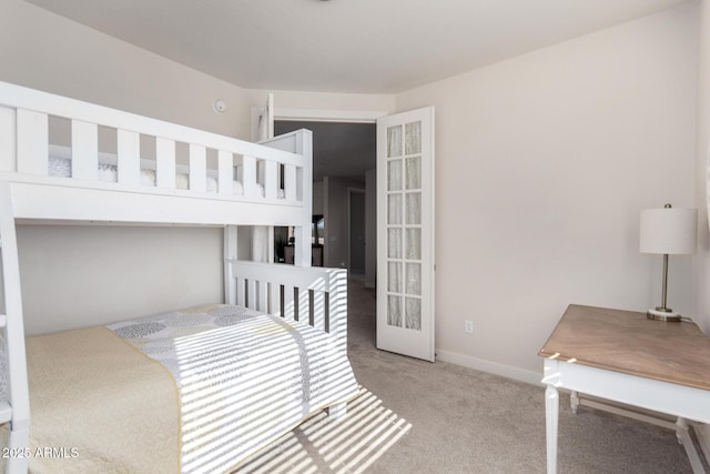 bedroom with carpet floors and french doors