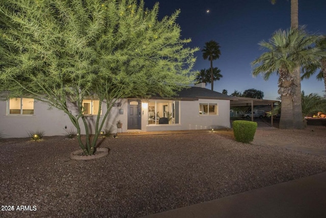 view of front of home with a carport