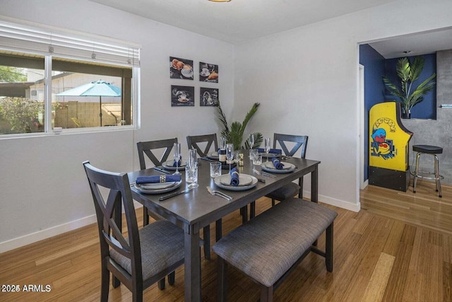 dining room with hardwood / wood-style flooring