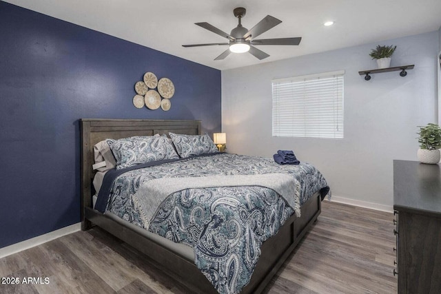 bedroom featuring hardwood / wood-style flooring and ceiling fan