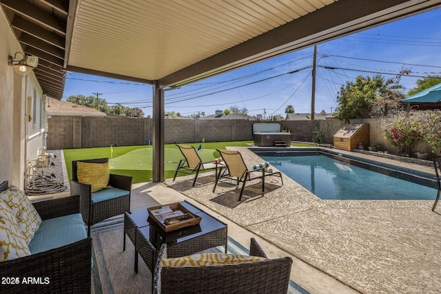 view of pool featuring an outdoor hangout area, a hot tub, and a patio area