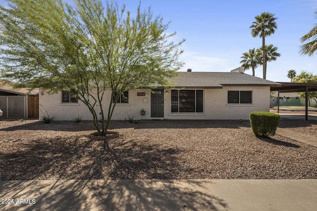 view of front of property featuring a carport