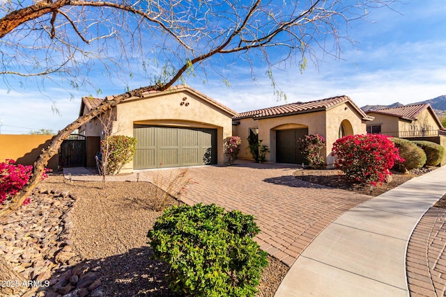 mediterranean / spanish-style house featuring a garage